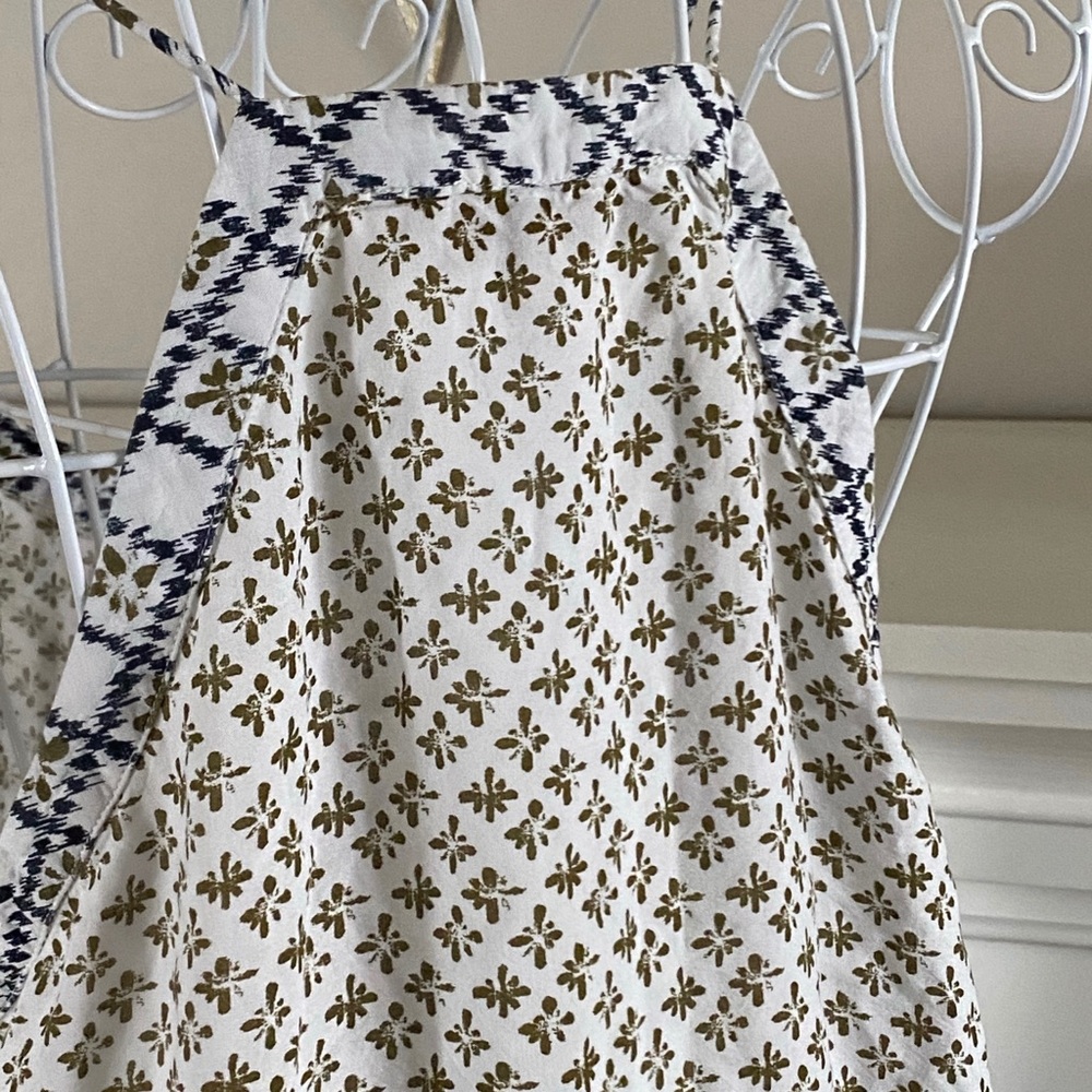 Soft, white, neutral patterned camisole.